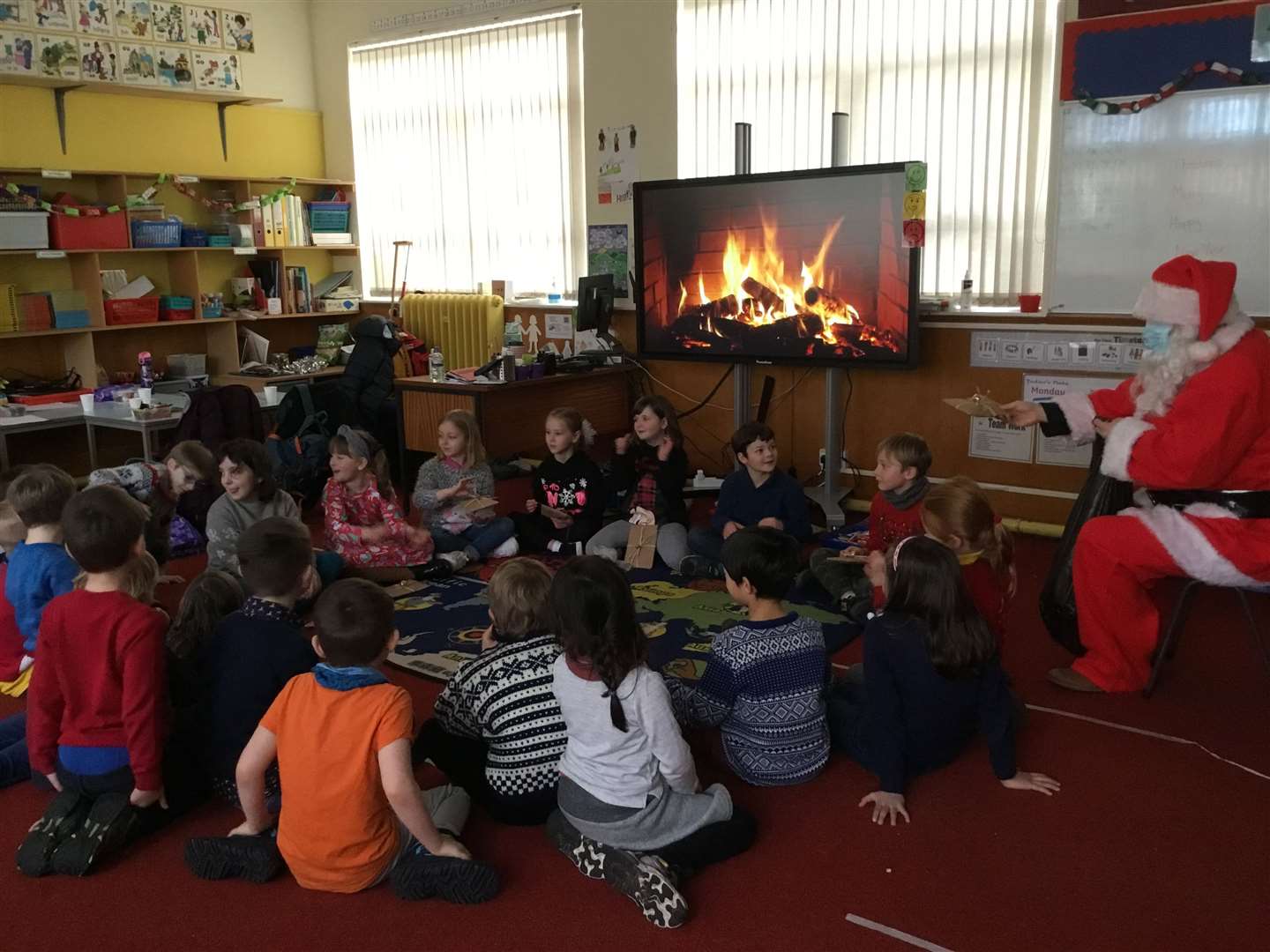 Pupils gathered round a virtual log fire.