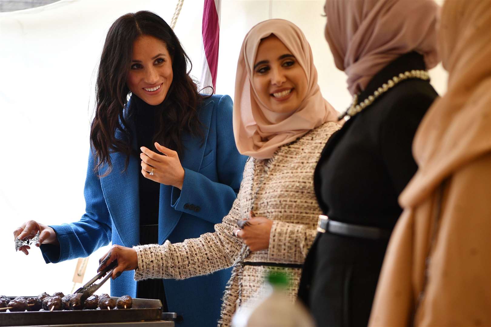 The Duchess of Sussex in 2018 with the women behind the cookbook she championed (Ben Stansall/PA)