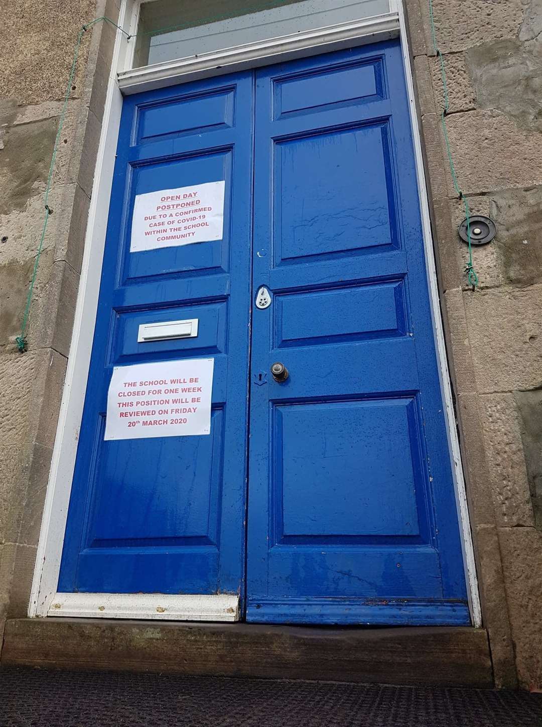 The notices on the door.