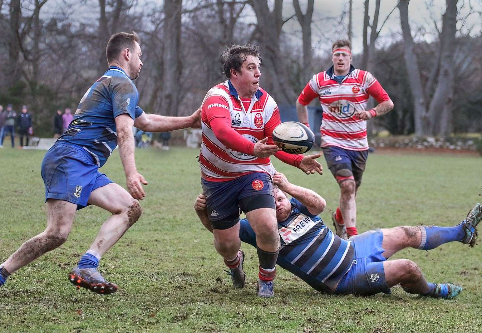 Cameron Hughes looks to offload in tackle. Hugh MacRae is in the background. Picture: John MacGregor