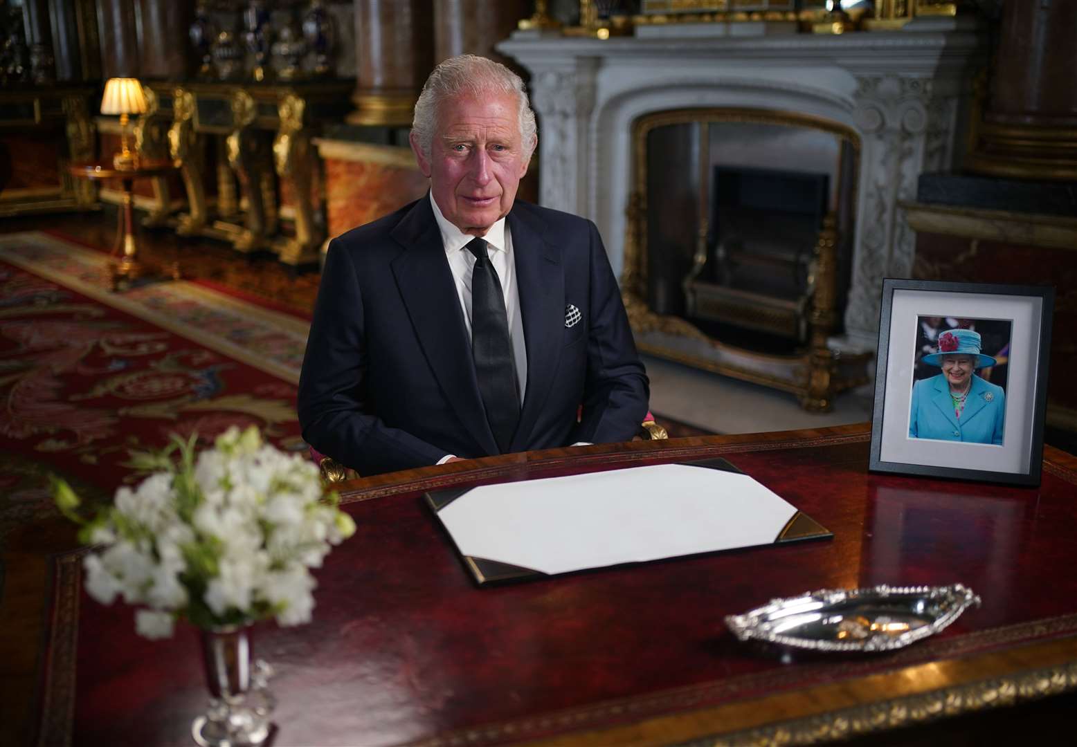 The King delivers his address to the nation and the Commonwealth from Buckingham Palace (Yui Mok/PA)