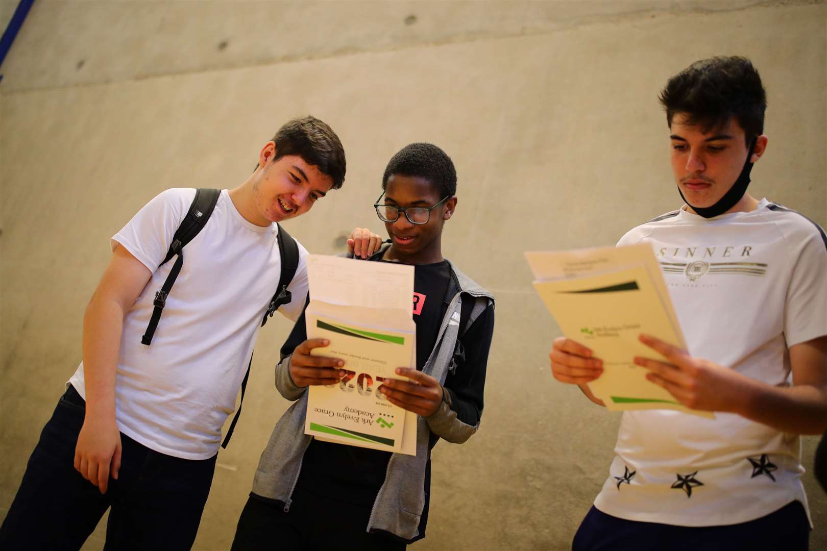 Students discuss their GCSE results at Ark Evelyn Grace Academy (Aaron Chown/PA)