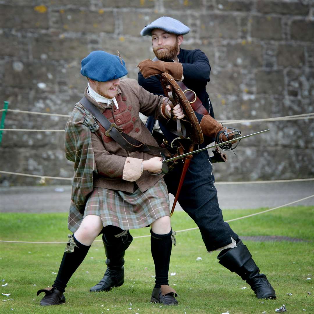 Martin Scott (right) scraps it out 1640's style during a fighting display from members of historical reenactment group Erskine's Regiment. Picture: Gair Fraser