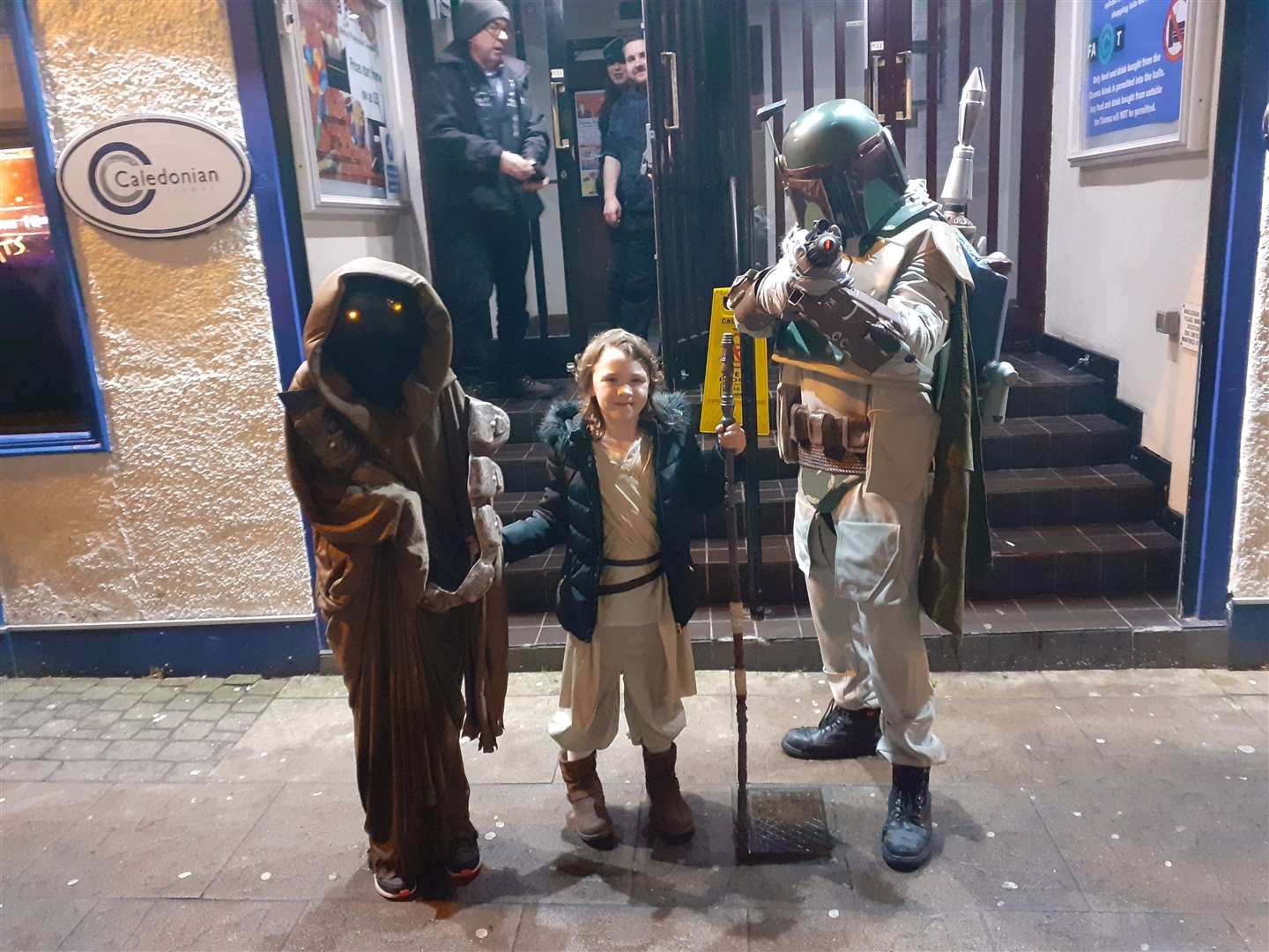 Nicole, Caitlyn and Mark dressed as a Jawa, Rey Skywalker and Boba Fett for the latest Star Wars premiere at the Moray Playhouse cinema.