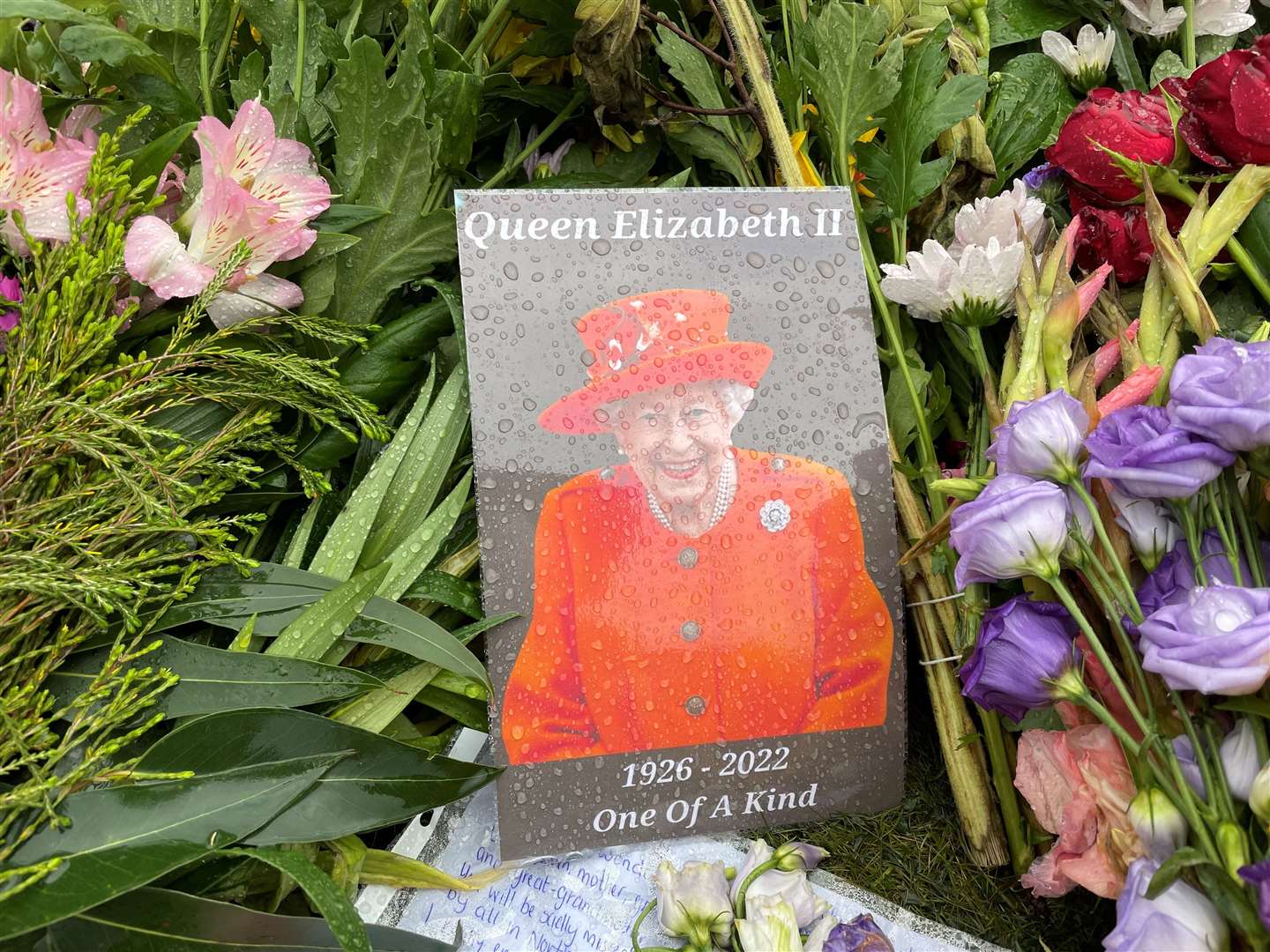 A tribute to the Queen which has been left at the gates of Hillsborough Castle (Jonathan McCambridge/PA)