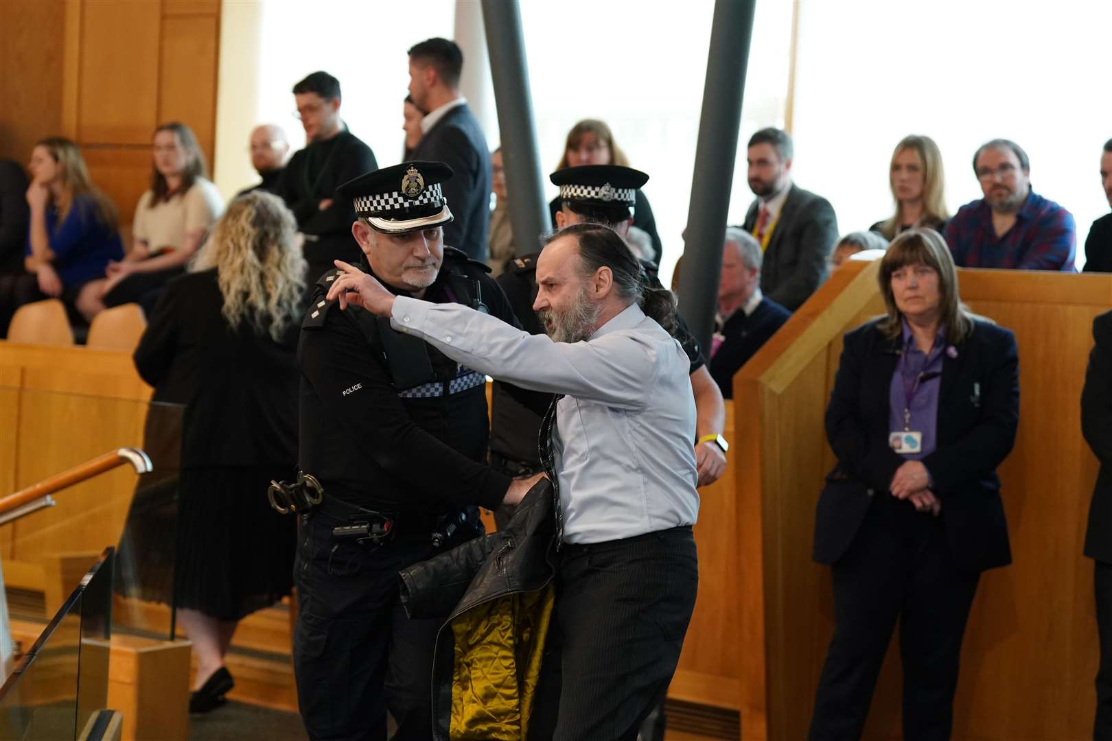 First Minister’s Questions was interrupted five times by protesters on Thursday (Andrew Milligan/PA)