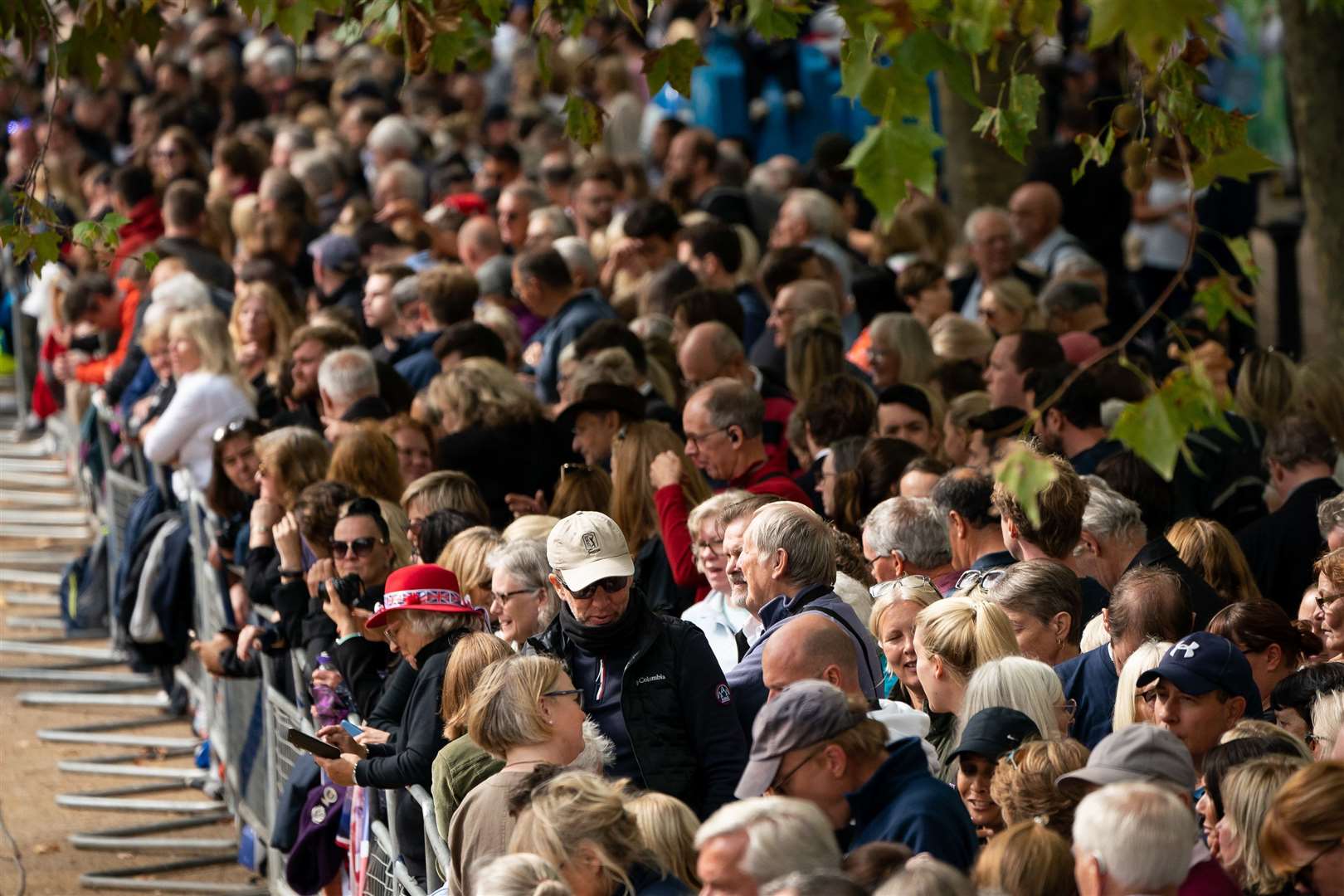 Crowds gather along the Mall ahead of the ceremonial procession (Aaron Chown/PA)