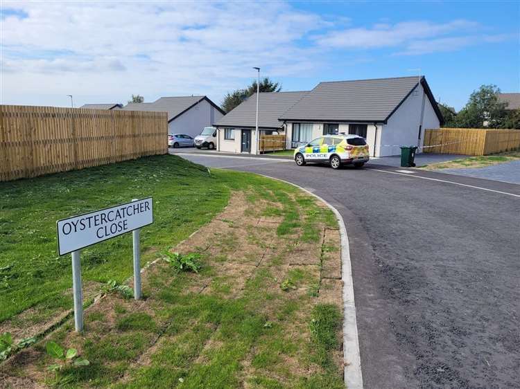 Police outside the house in Forres soon after the incident. Picture: Highland News and Media