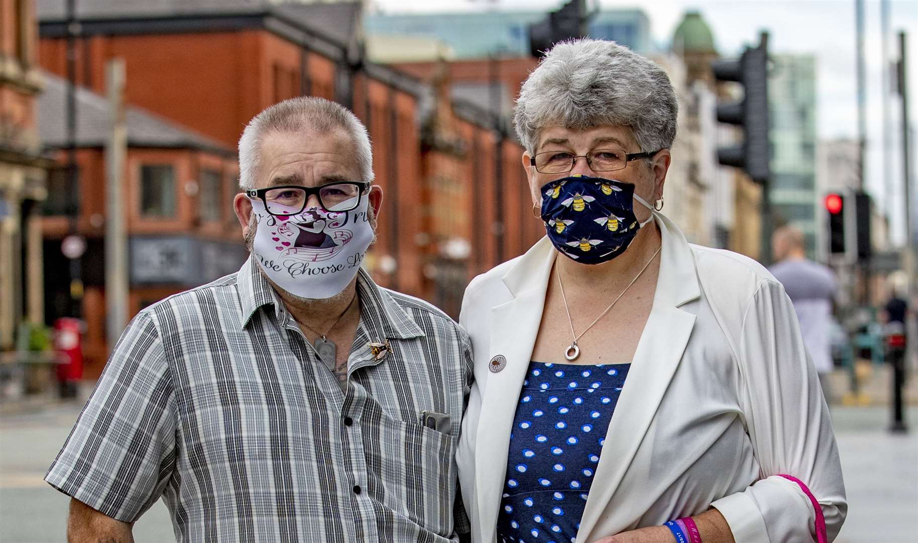 Family and friends of the Manchester bomb victims, wearing masks in support of the victims, arrive at the Hilton Hotel in Manchester to watch the sentencing of Hashem Abedi via videolink (Peter Byrne/PA)