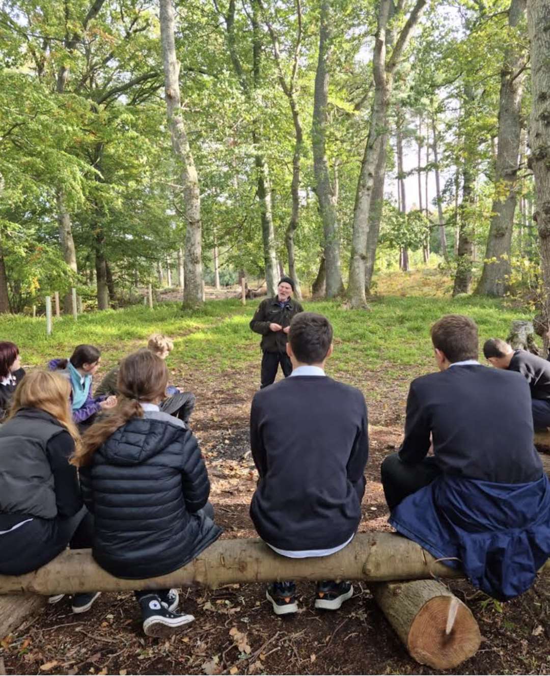 Woodland project manager and treasurer George Paul talking to Forres Academy students during an outdoor lesson.