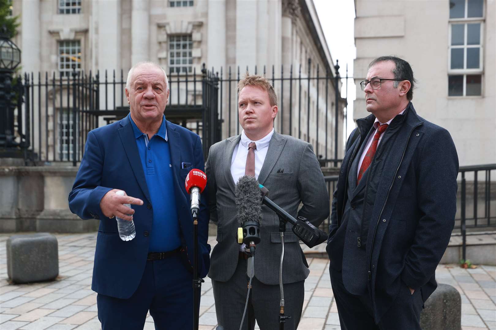 Campaigner Raymond McCord, left, speaks to the media outside the Royal Courts of Justice (Liam McBurney/PA)