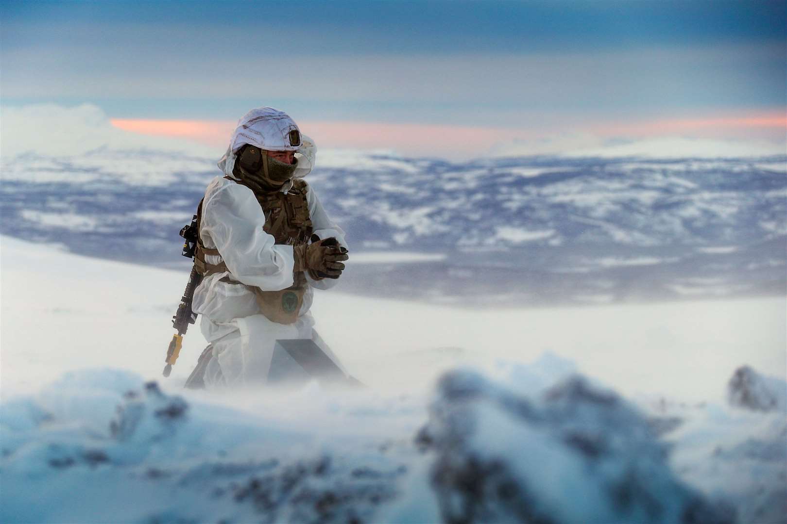 A Royal Marines assault engineer of 45 Commando preparing a charge during ice demolition training in the Arctic Circle, taken by Leading Photographer Stevie Burke (LPhot Stevie Burke/MoD/Crown Copyright)