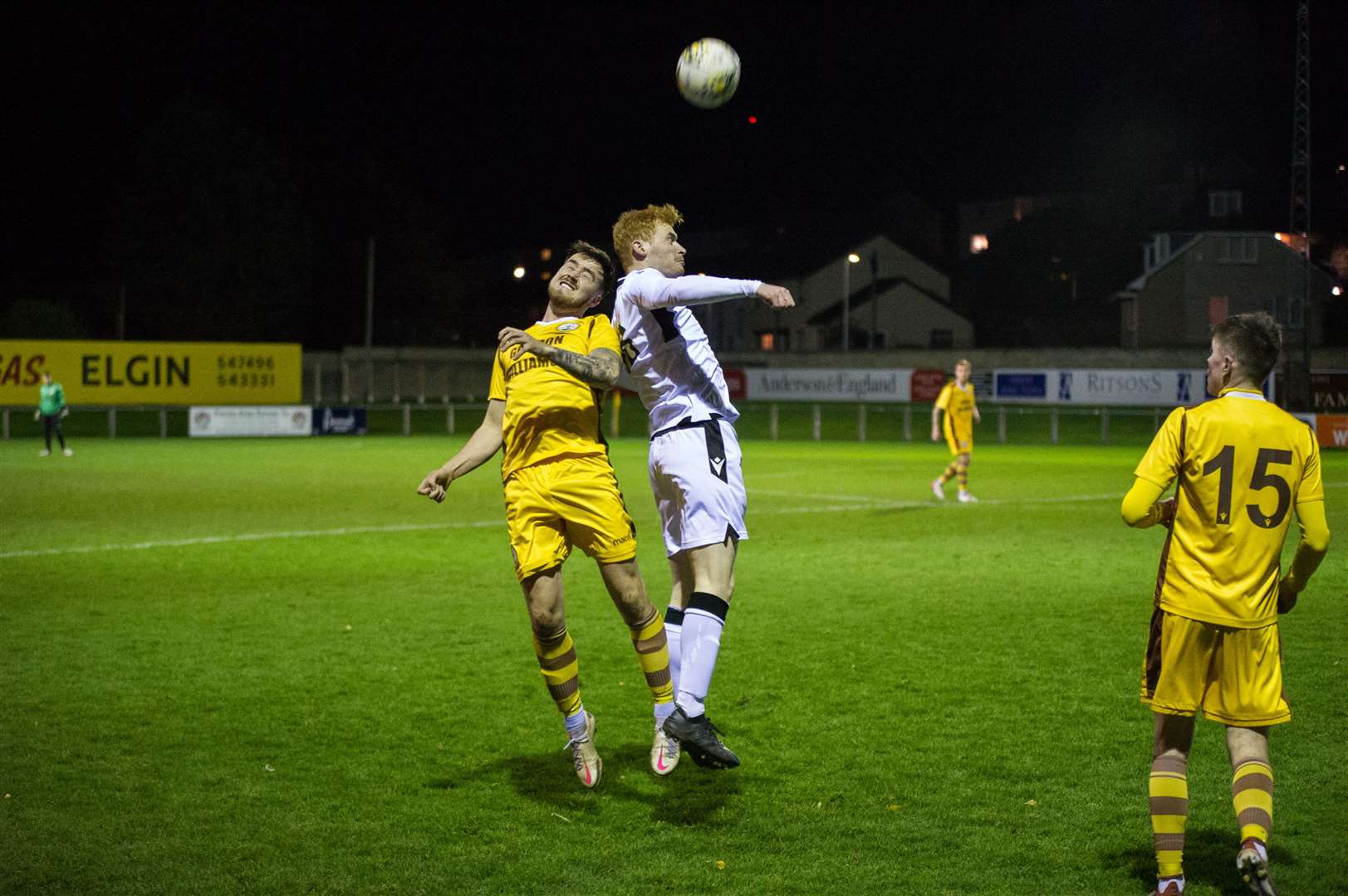 Forres' Martin Groat and Rothes' Greg Morrison challenging for the ball in the air. Picture: Becky Saunderson