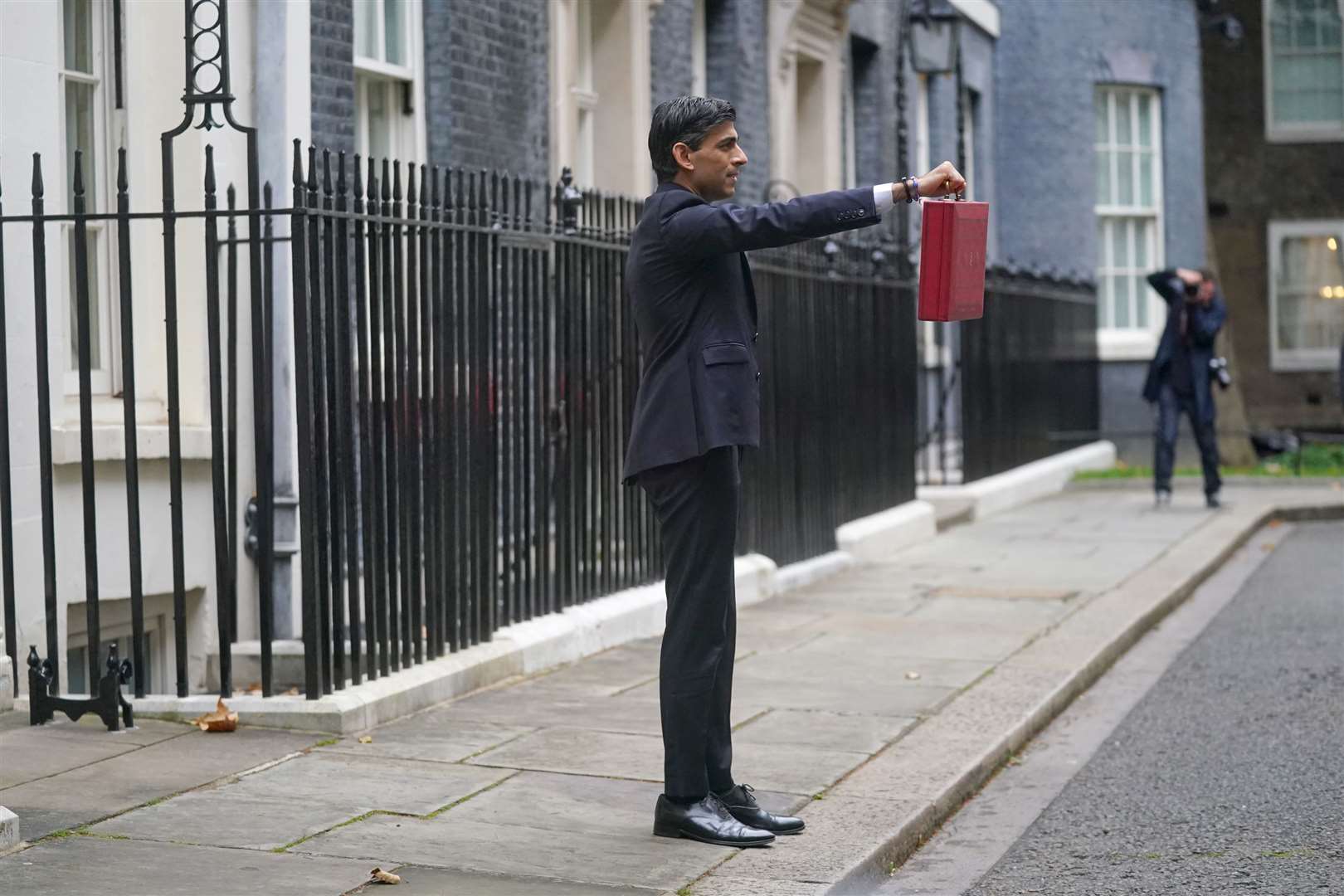 Rishi Sunak holds his ministerial red box outside 11 Downing Street (Victoria Jones/PA)