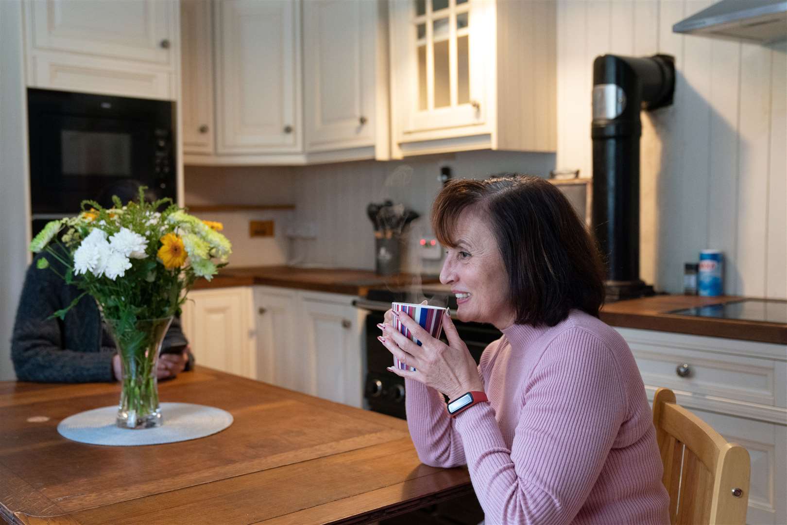Iryna Starkova enjoys a cup of tea in her new home in Cambridgeshire (Joe Giddens/PA)