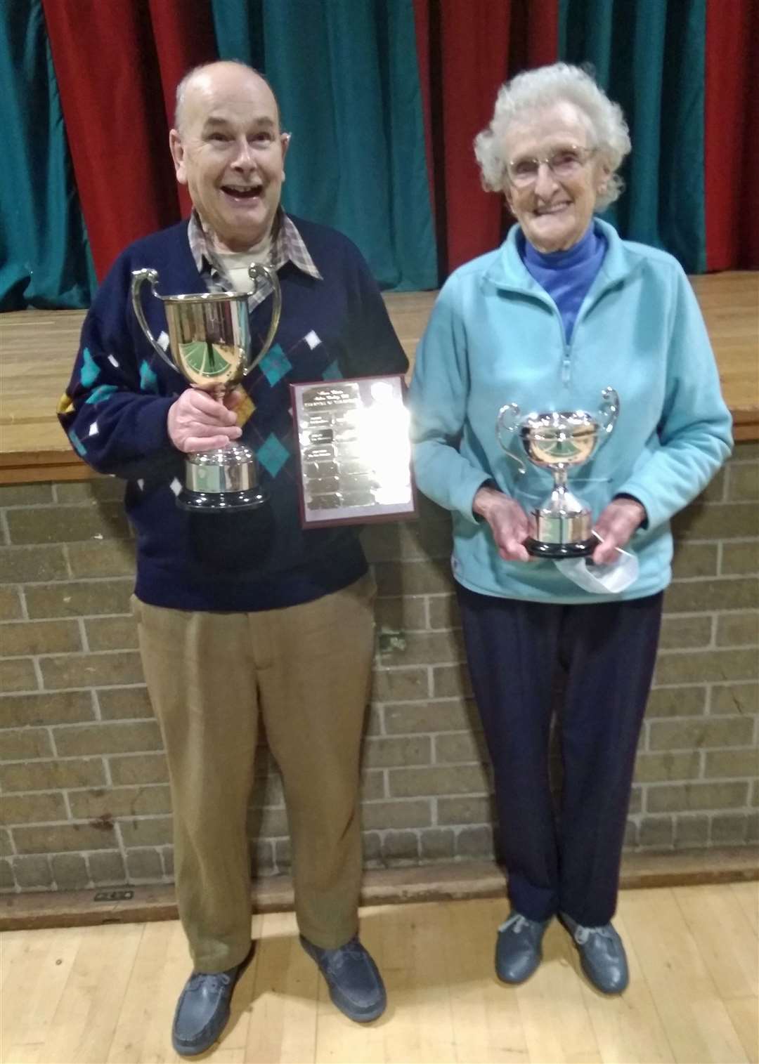 Ladies champion Ann McPherson and club champion Ian Stewart with their trophies.