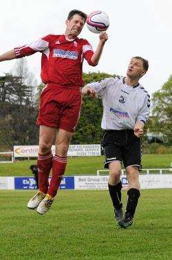 Forres' Mark Pennie rises to head clear from Rovers Shaun Findlay.