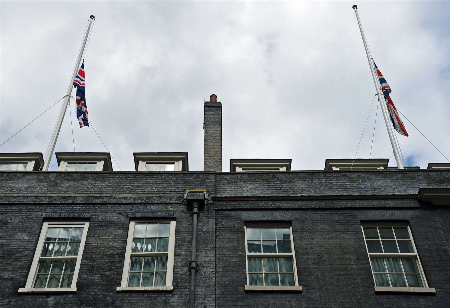 Union Flags are at half mast at Government buildings like Downing Street (Kirsty O’Connor/PA)