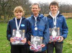 Forres Acsdemy pupil Kathryn Barr, big brother Andrew and Eddie Harwood with the gold and silver medals they claimed at the British Championships orienteering event in Loughborough