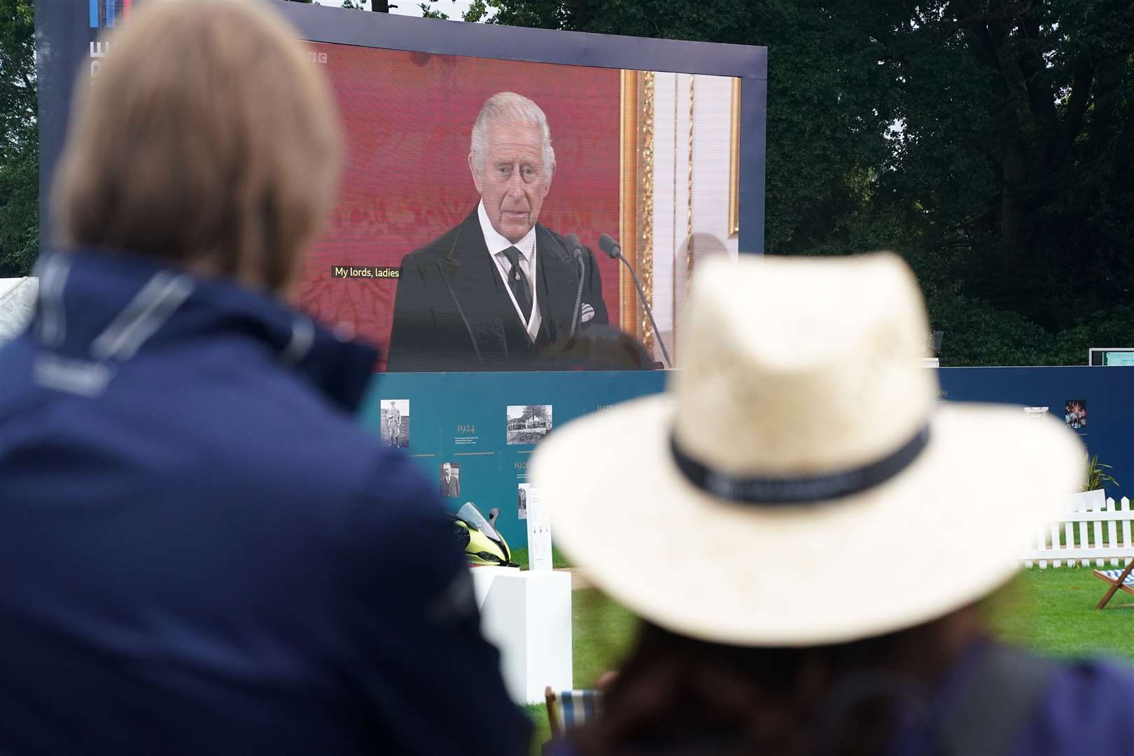 Spectators watch the Accession Council, where King Charles III is formally proclaimed monarch, on the big screen at Wentworth Golf Club (Adam Davy/PA)