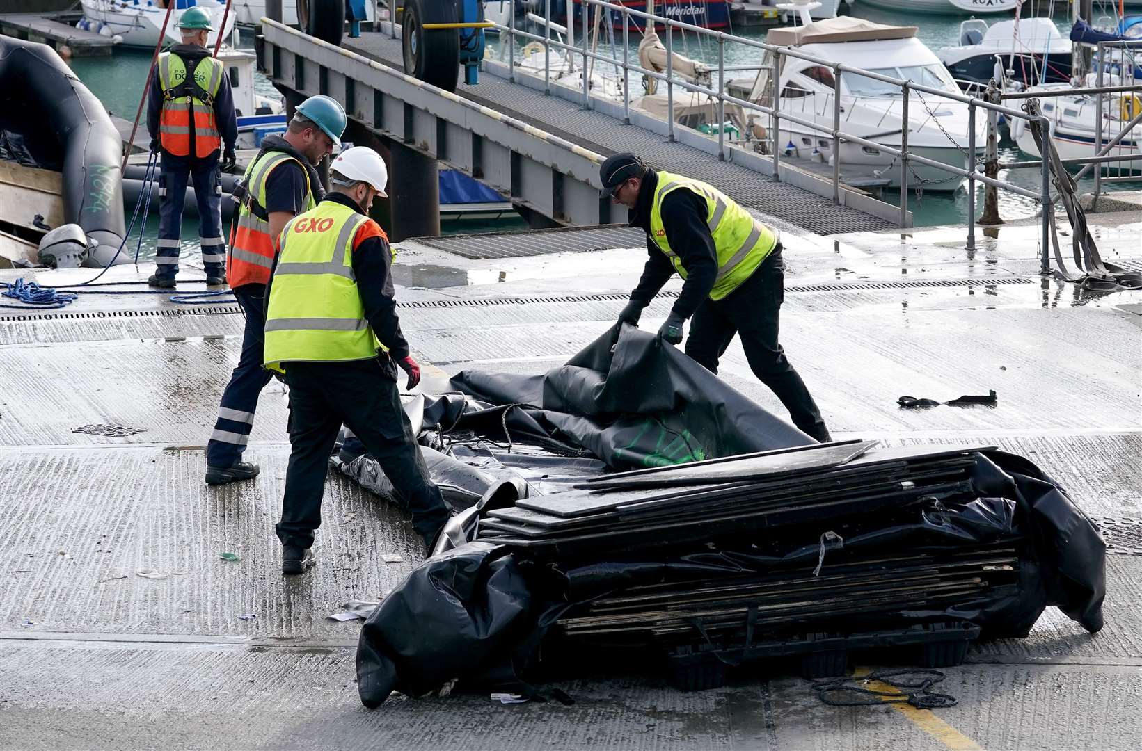 Small boats being taken away from the Port of Dover (Gareth Fuller/PA)