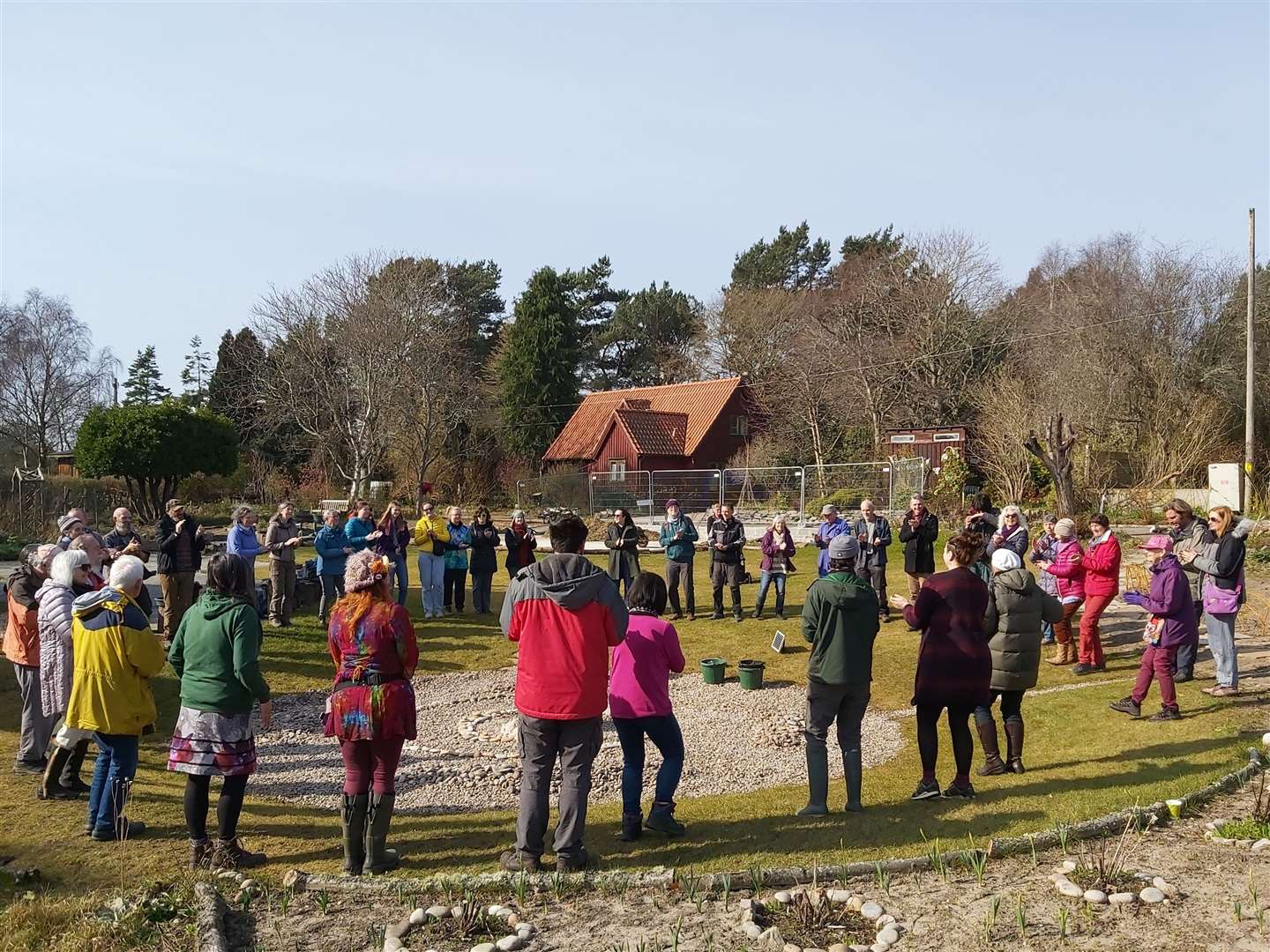 Residents of The Park gathering in the new garden at the site to celebrate its re-opening a year later.
