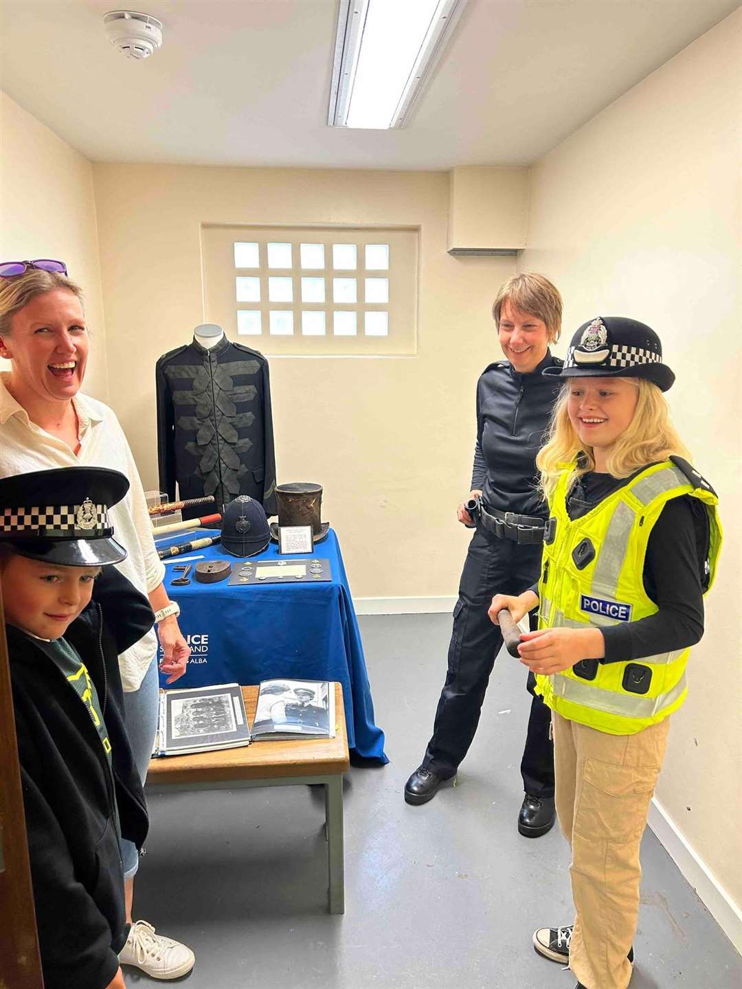 Inspector Claire Smith with her exhibition of old police uniform and equipment.