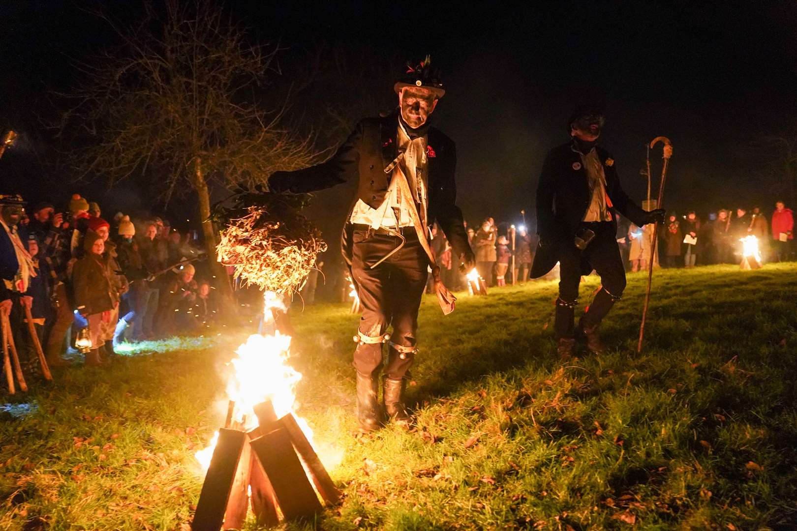 Silurian Morris Men at Westons Cider Mill in Ledbury during a wassail ceremony to bless trees in the hope of promoting a good harvest for the next cider and perry season, and warding off bad spirits from the orchard (Jacob King/PA)