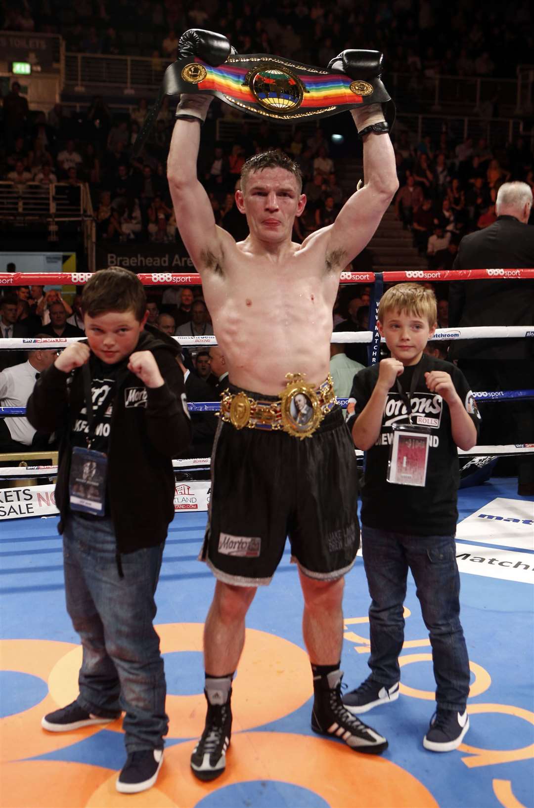 Willie Limond celebrates beating Curtis Woodhouse during a bout at the Braehead Arena, Glasgow (Danny Lawson/PA)