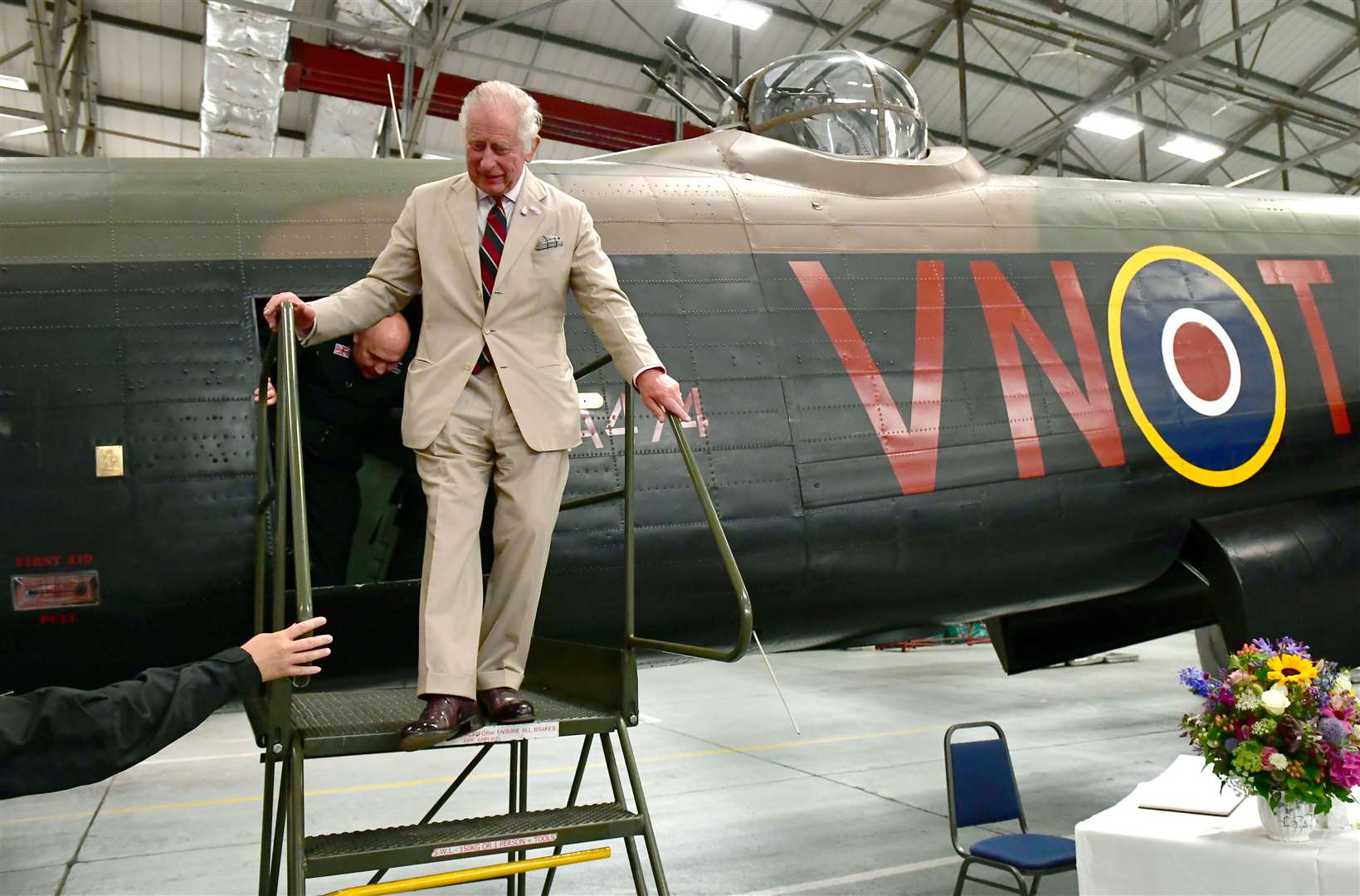 Charles inspects one of the aircraft during his visit to the Battle of Britain Memorial Flight in Lincolnshire (David Dawson/National World/PA)