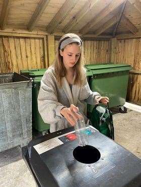Lisa recycling plastic bottles at her dad’s home in Twickenham. The former Forres Academy pupil is passionate about recycling.