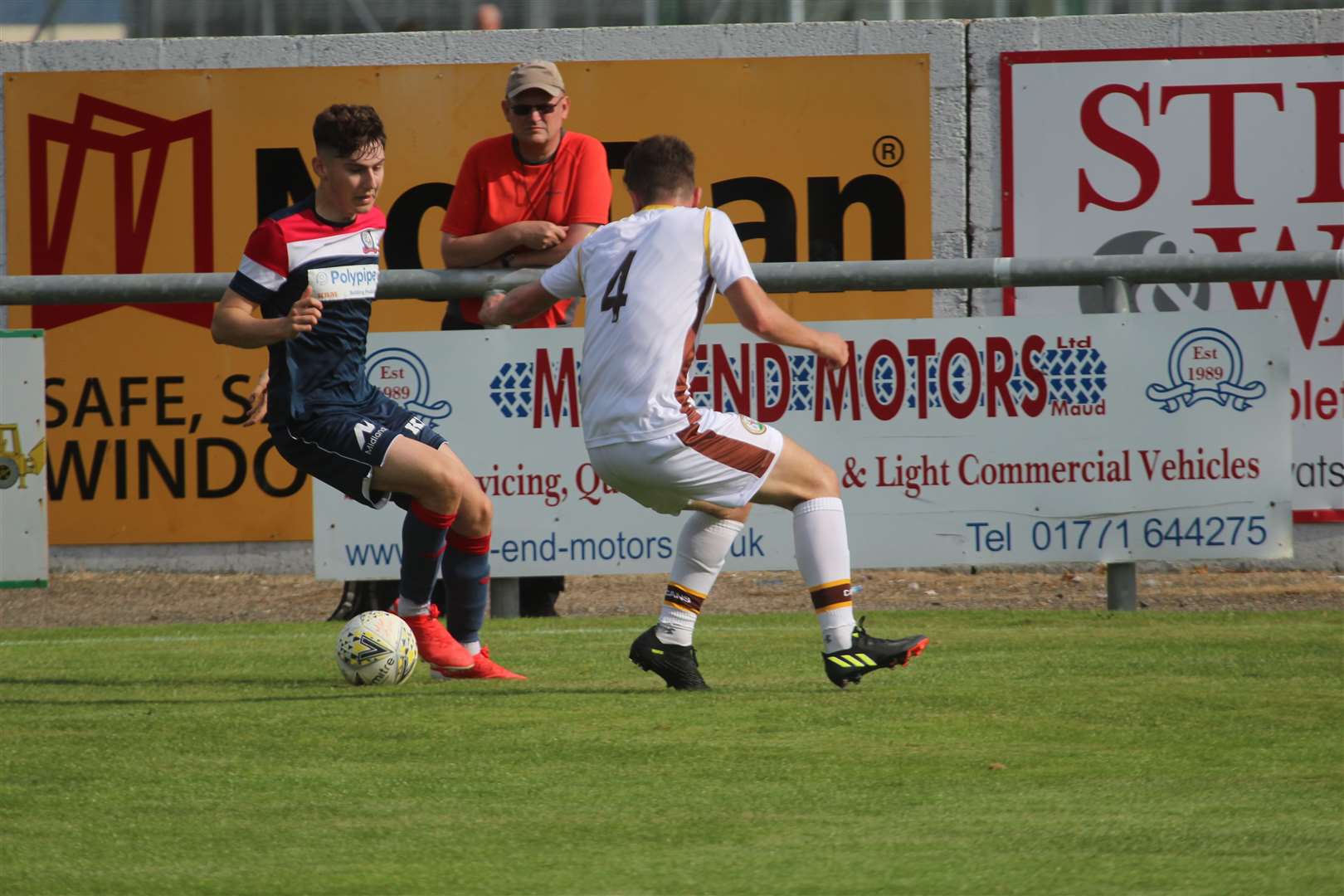 Forres Mechanics centre-back Ruari Fraser gets tight to his man. Picture: Kyle Ritchie