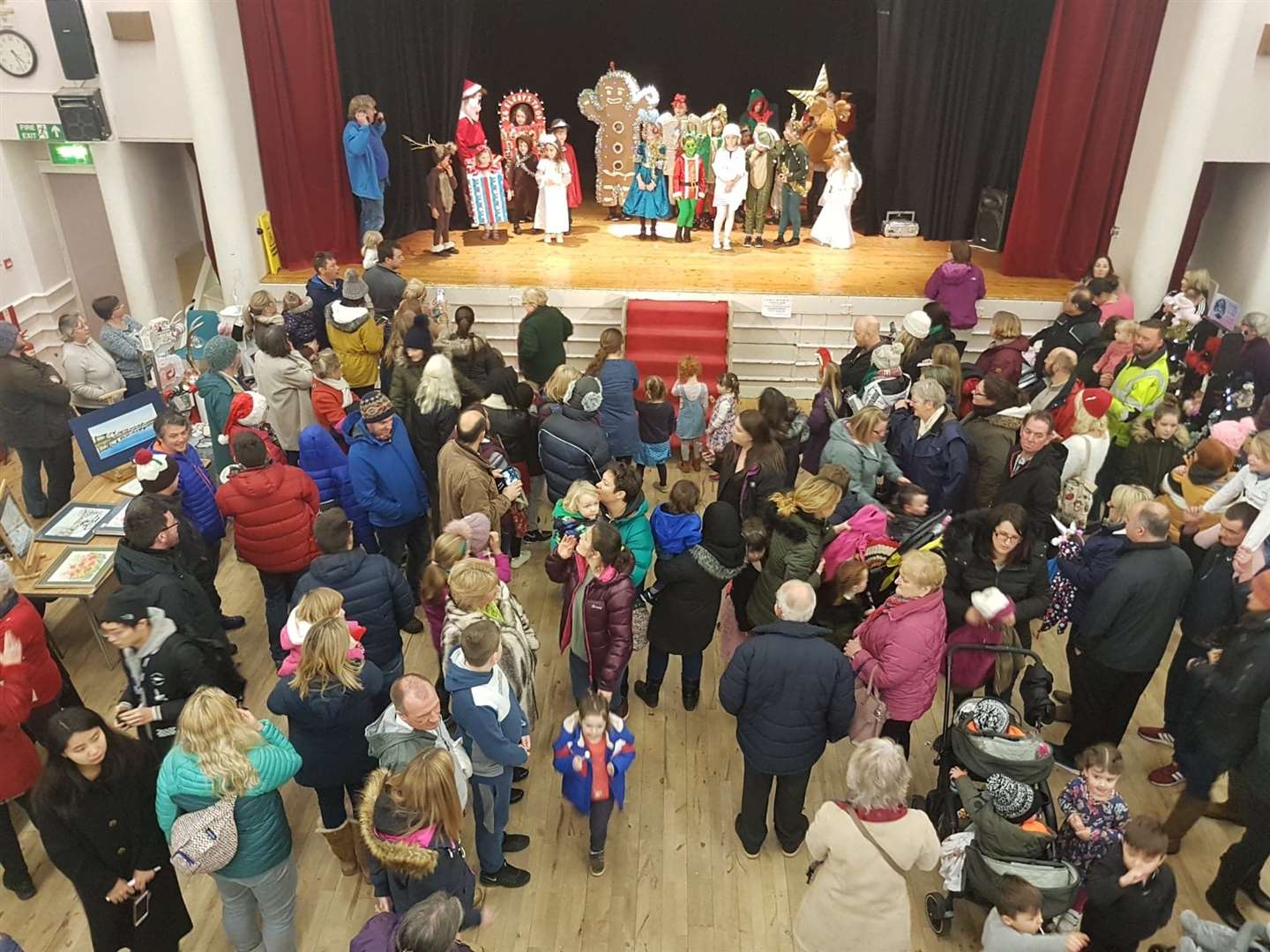 The costume competition entrants gathering on the stage ahead of judging by Santa.