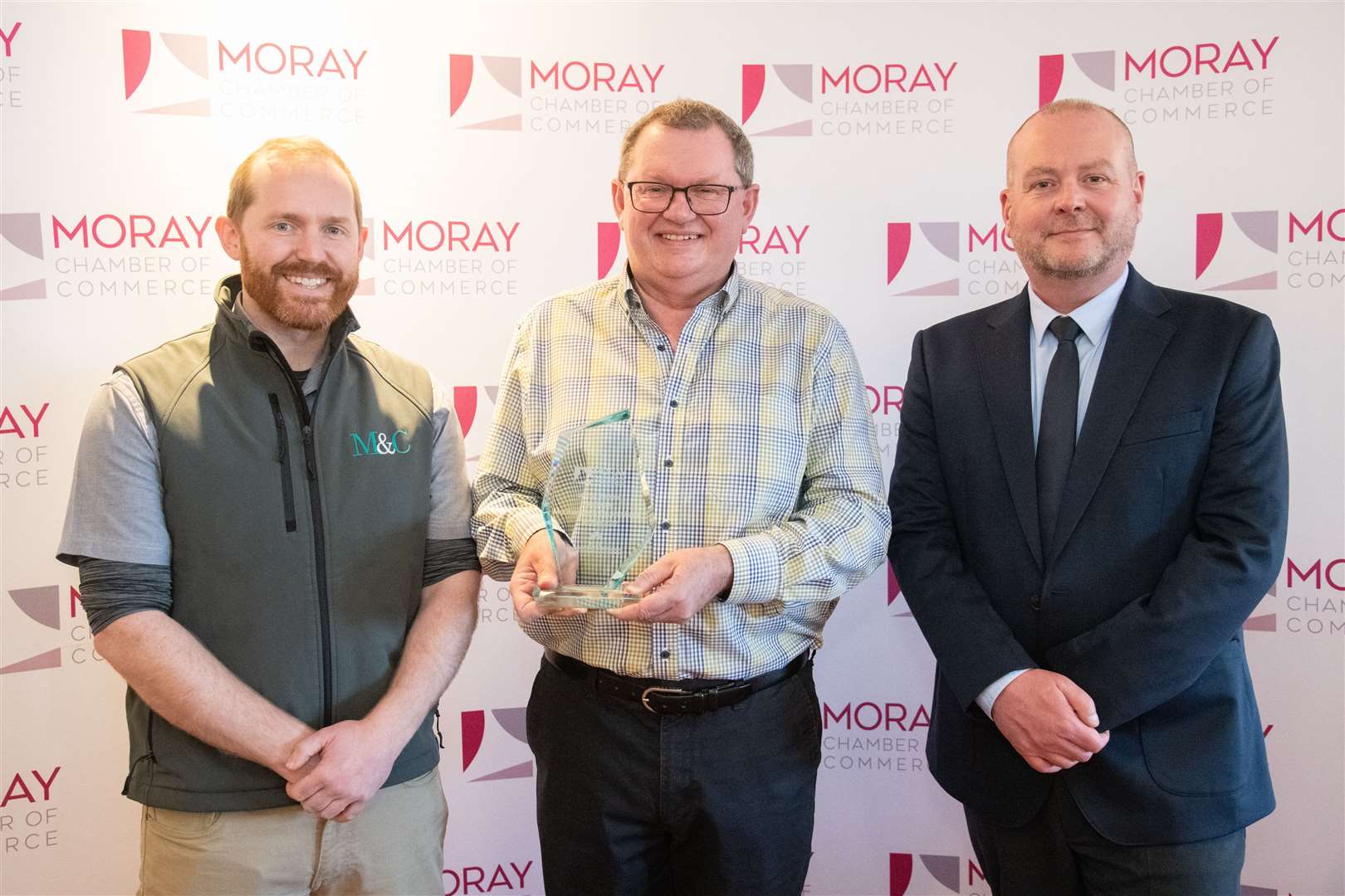 Alistair and Peter Wilson with David Reid from HIE at the Moray Chamber of Commerce Awards in 2022 where they won SME of the Year.