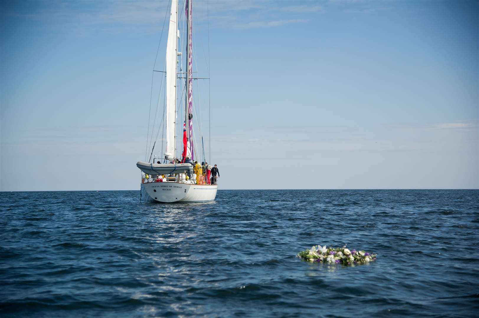 Gordonstoun School sailors pay tribute to Prince Philip by casting a wreath from their boat, Ocean Spirit of Moray, off Hopeman Harbour. Picture: Becky Saunderson.