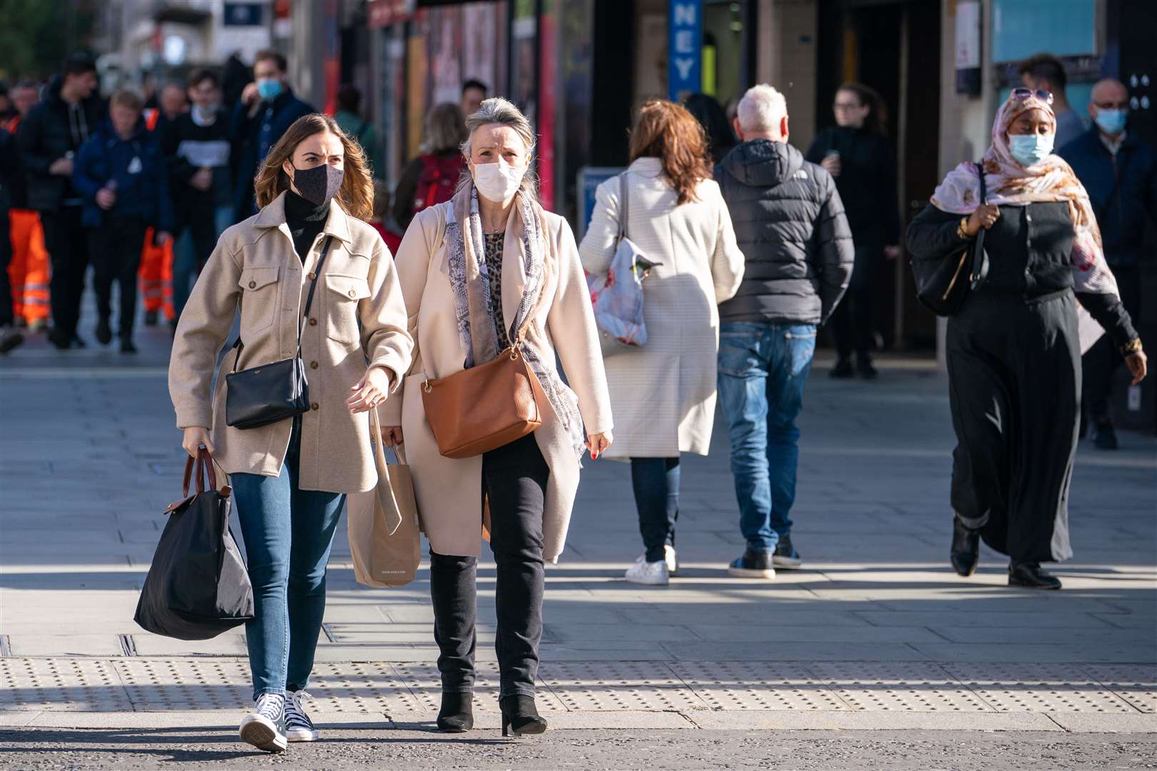 Shoppers wearing face masks on Oxford Street, in central London (Dominic Lipinski/PA)
