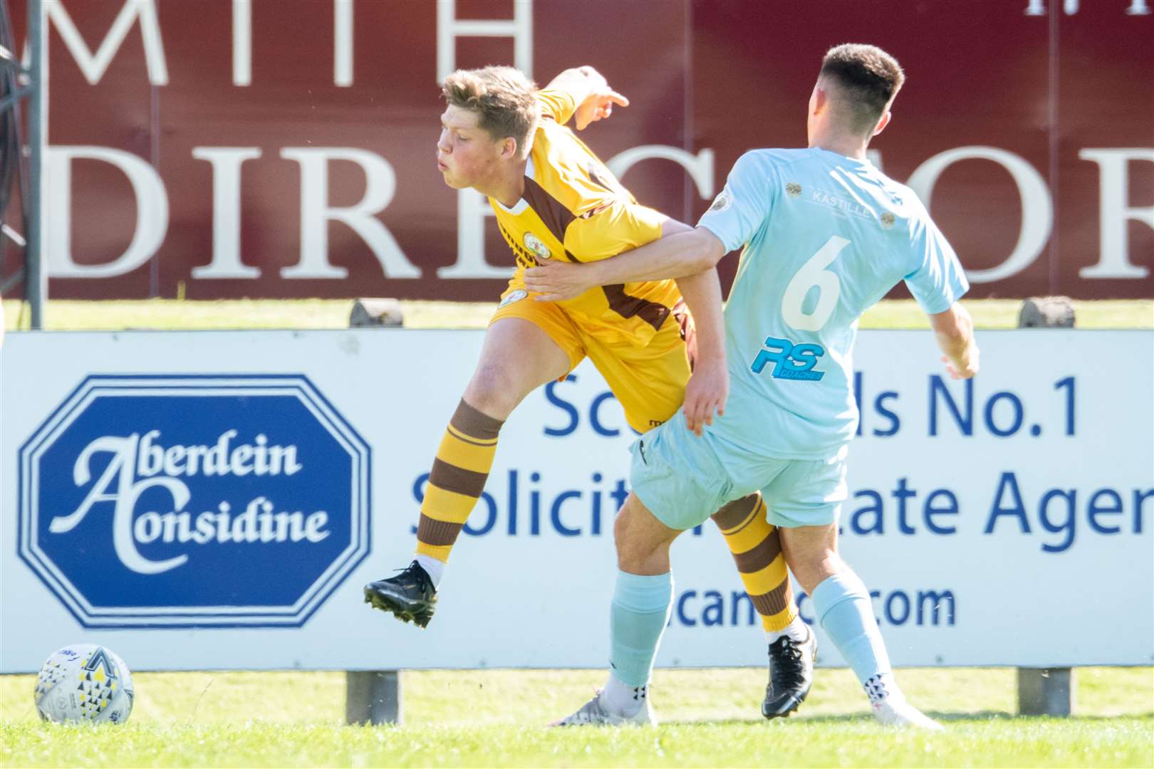 Keith's Connor Killoh stops Forres' Ethan Cairns in tracks with a solid tackle...Forres Mechanics FC (1) vs Keith FC (2) - Highland Football League 22/23 - Mosset Park, Forres 27/08/2022...Picture: Daniel Forsyth..