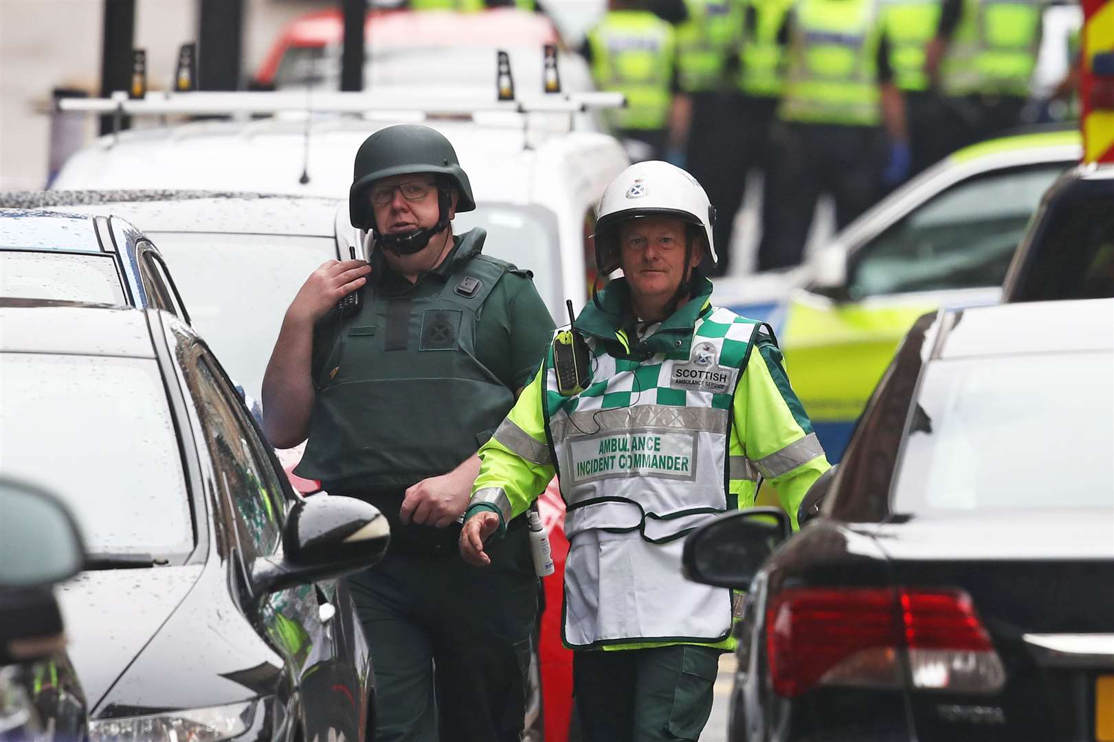 Members of the emergency services at the scene of the attack (Andrew Milligan/PA)