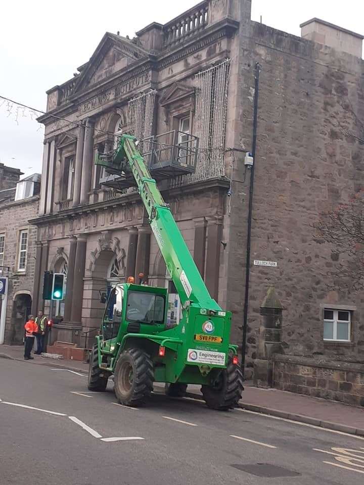 Putting up the town hall display.