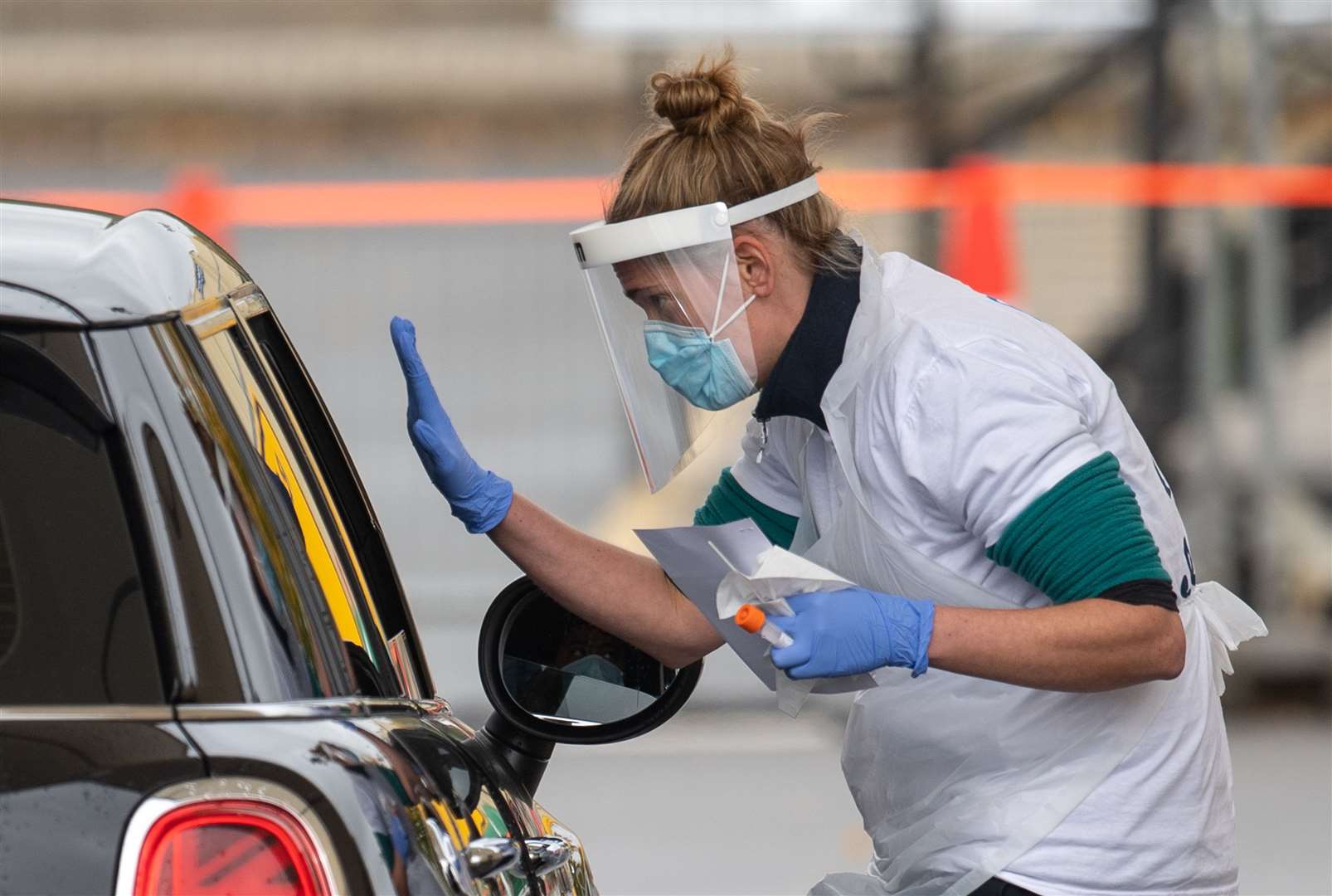 Staff collect samples at a drive-through test centre (Joe Giddens/PA)