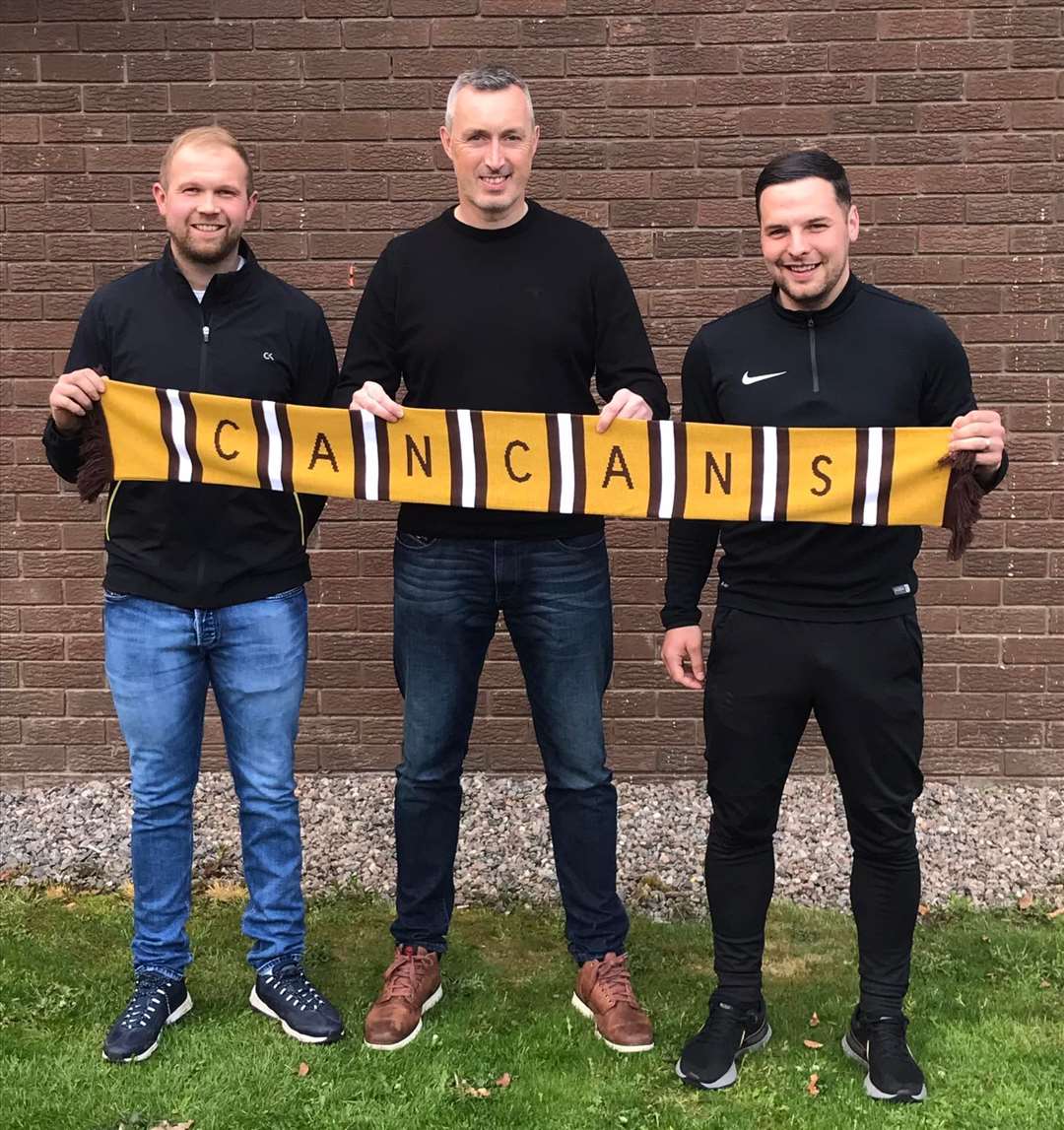Robert Donaldson (left) and Andrew Skinner (right) are pictured with Forres Mechanics manager Steven MacDonald after penning two-year deals with the club.
