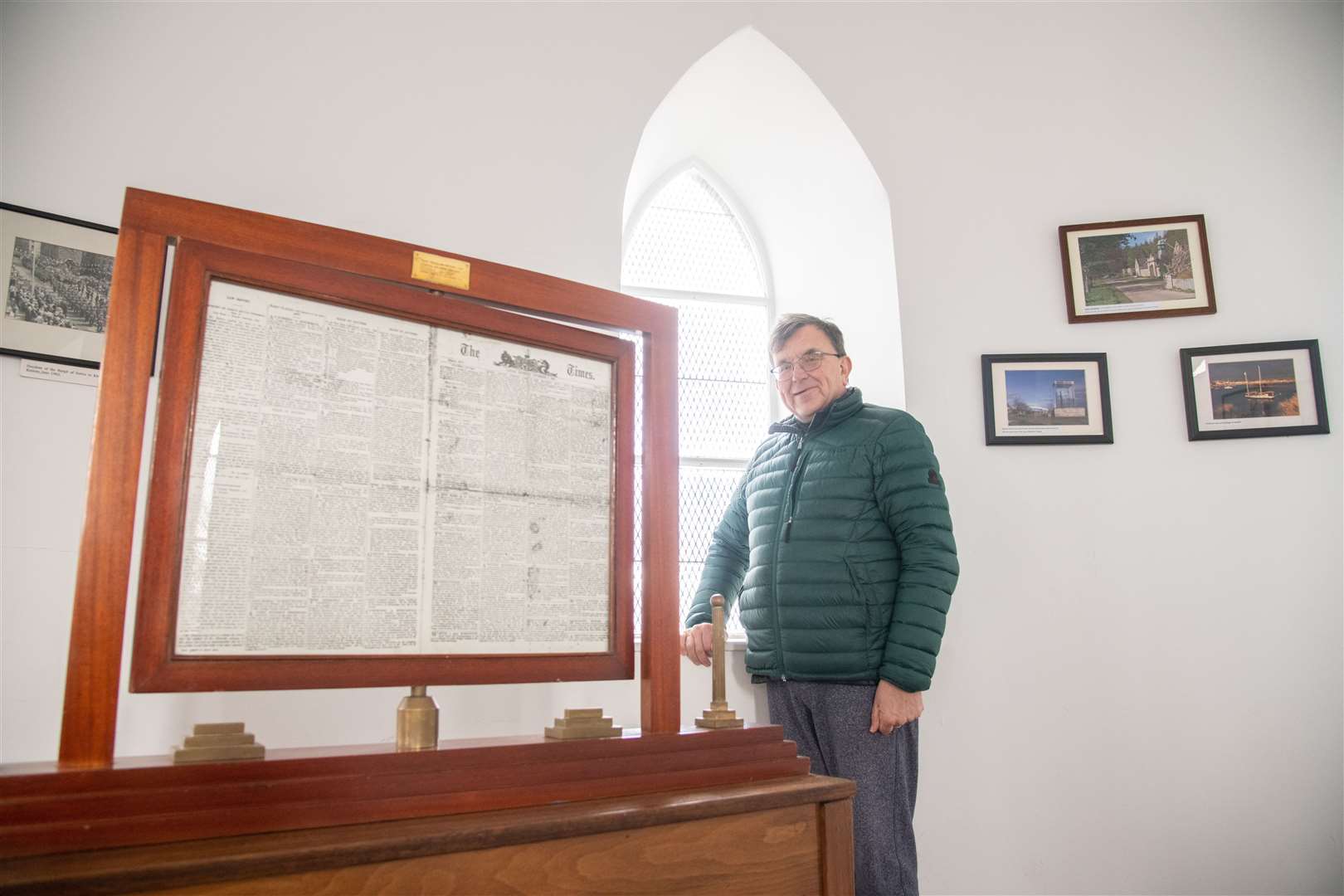 Volunteer Michael Ellison and part of the display inside the tower. Picture: Daniel Forsyth