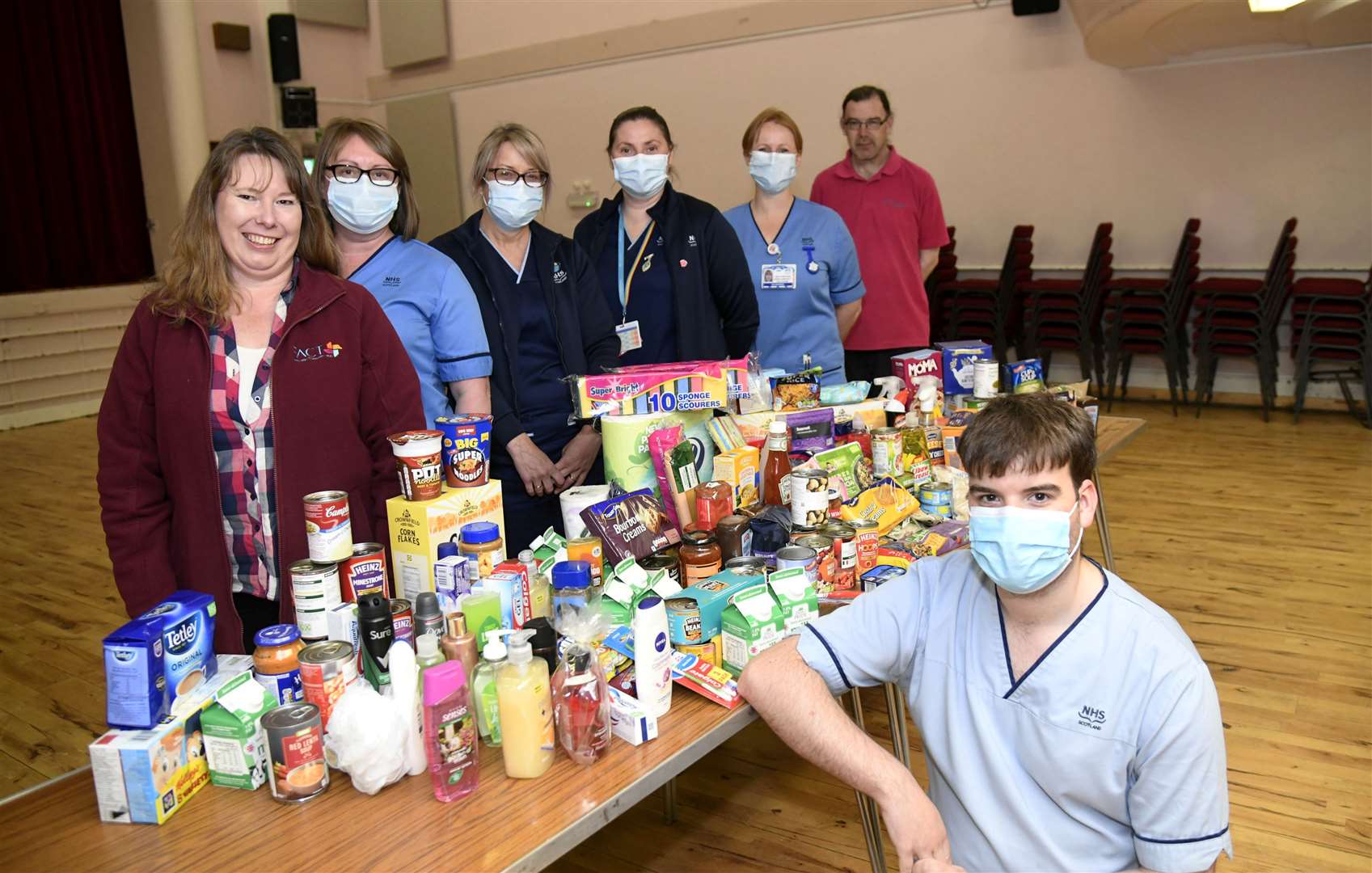 Staff at Forres Health Centre donate food to Forres Area Community Trusts Larder on International Nurses Day...From left are Lindsey Standring (FACT), Tracey Cooper, Fiona Adams, Danielle Mcleod, Lesley-Anne Exon, Graham Watson (FACT) and James Hynam (front)...Picture: Becky Saunderson..