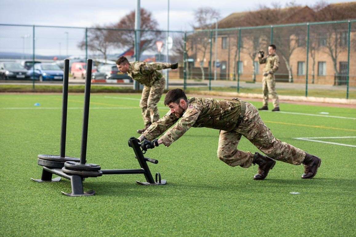 RAF Lossiemouth personnel back in group training outdoors yesterday.