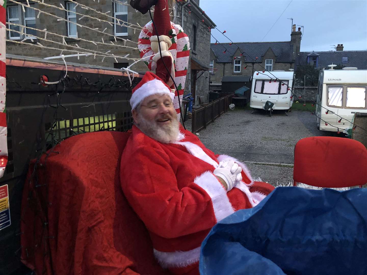 Reverend Alan McWilliam playing Santa Clause for the children of Forres.