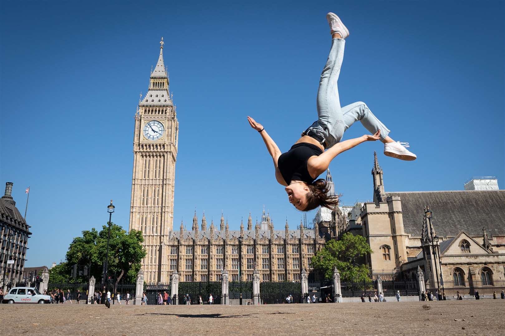 Trampolinist Nicole Steiner from Switzerland practices some moves on a dried out Parliament Square (Stefan Rousseau/PA)