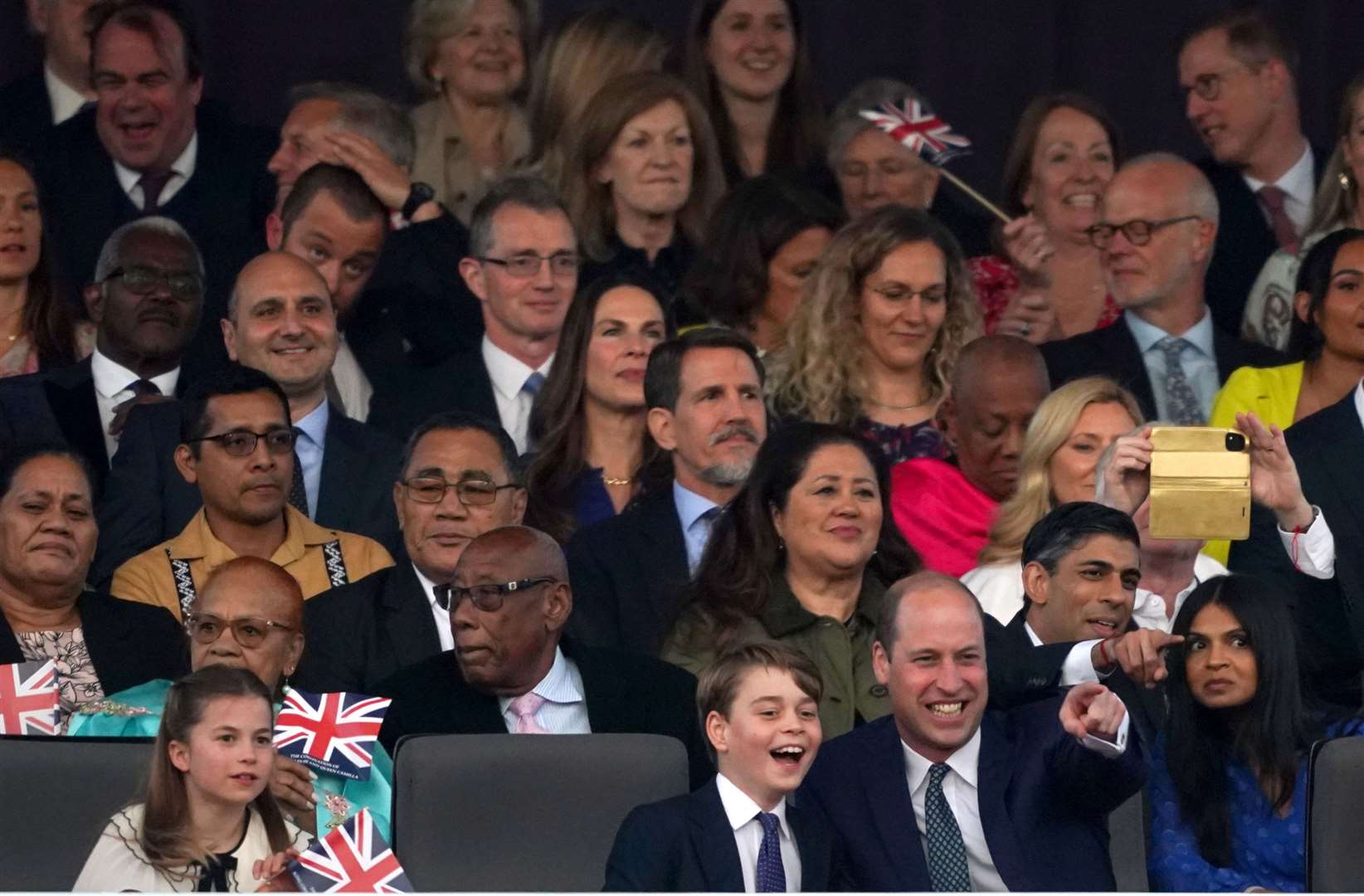 George and William enjoying the special coronation pop concert (Stefan Rousseau/PA)