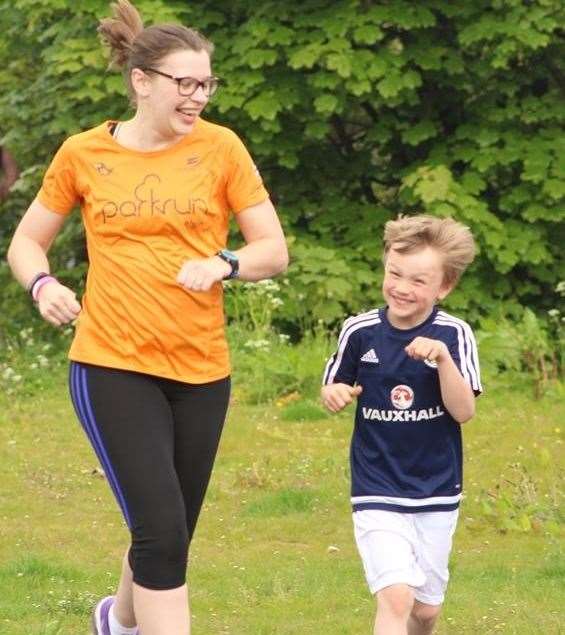 Six-year-old Callum Main from Findochty shows he is loving it as much as mum Debbie while on his way to achieving a remarkable time of 31 minutes for the 5km Elgin parkrun.