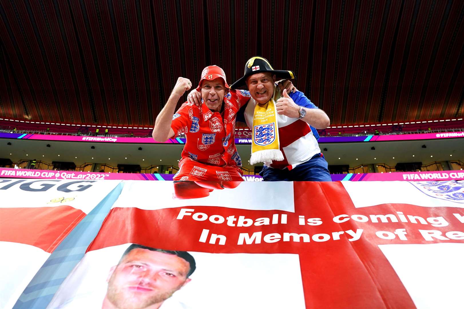England fans in the stands ahead of the match between England and Senegal at the Al-Bayt Stadium in Qatar (Martin Rickett/PA)
