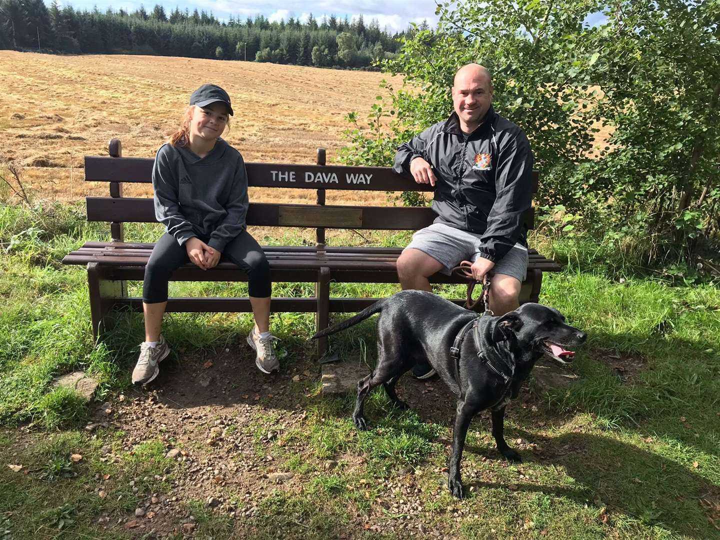 Roxy and Ross Homer having a rest at the half way point on the Dava Way.
